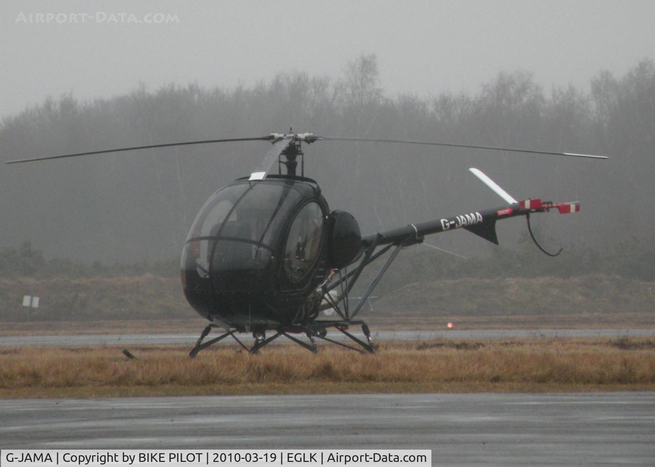 G-JAMA, 2004 Schweizer 269C-1 C/N 0165, VISITOR SITTING IN THE RAIN AT A MURKY BLACKBUSHE