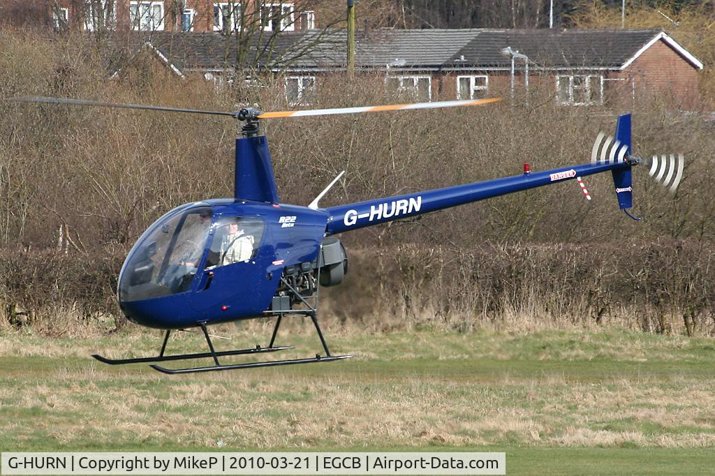 G-HURN, 1990 Robinson R22 Beta C/N 1441, Climbing away from Barton.