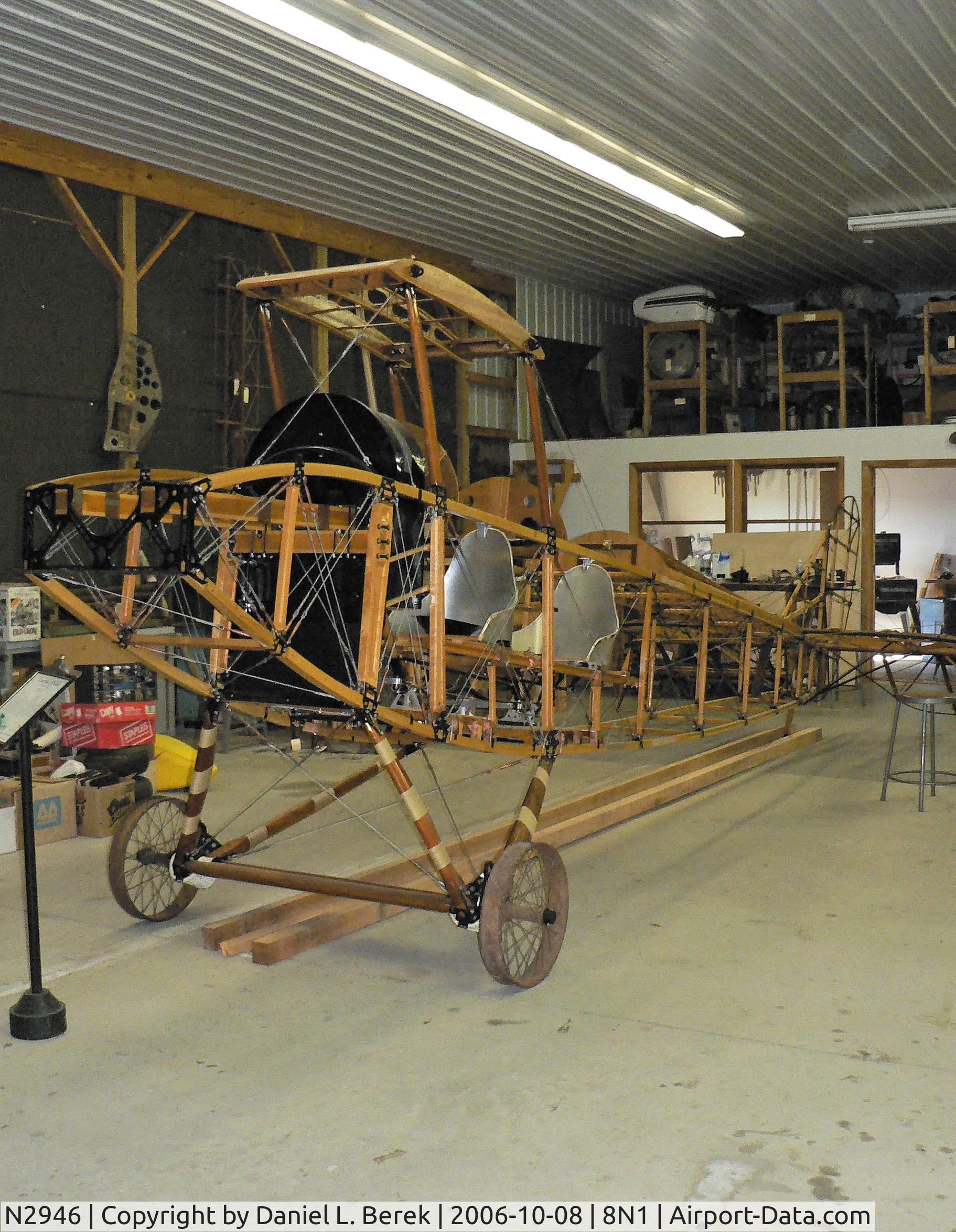 N2946, Curtiss JN-4D Jenny C/N 8047, Here the GAAM Jenny is undergoing restoration; since 2009, she has been resplendent, flying in her sparking red coat.