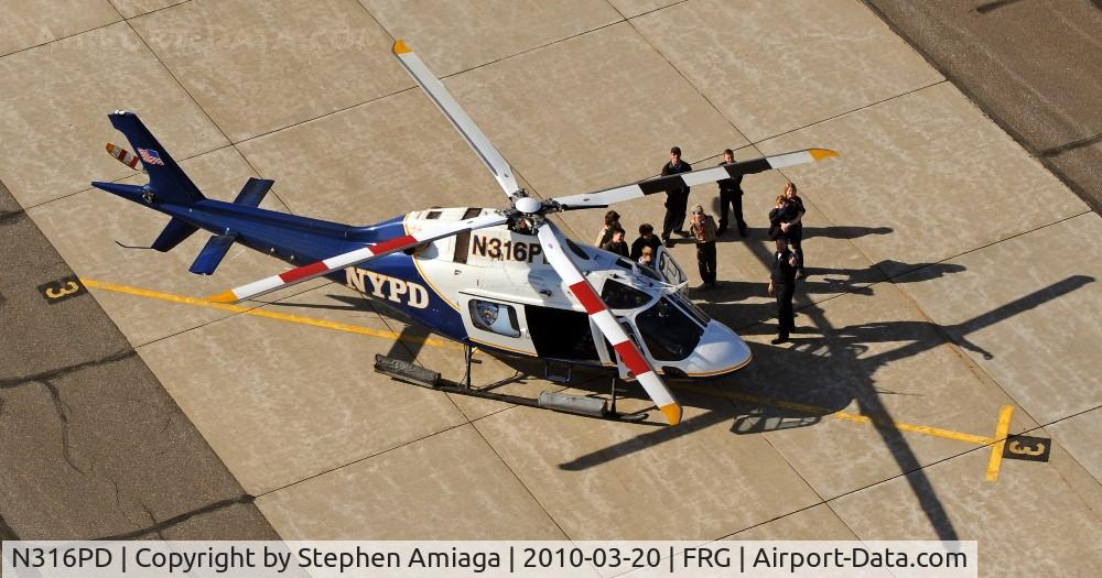 N316PD, 2003 Agusta A-119 C/N 14038, Boy Scouts checking out the Helo on the Main Terminal Ramp