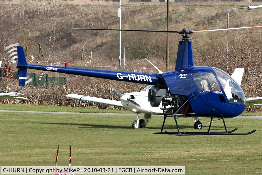 G-HURN, 1990 Robinson R22 Beta C/N 1441, Departing from the pumps.