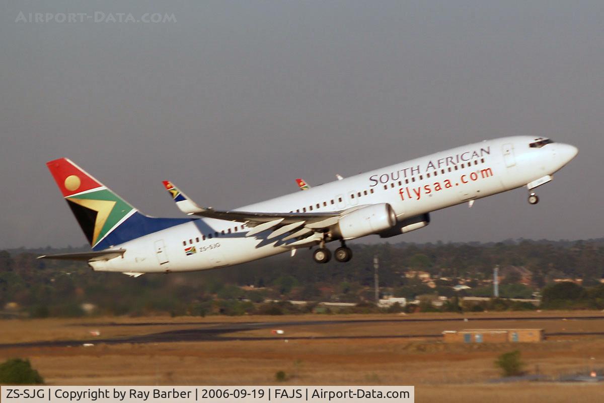 ZS-SJG, Boeing 737-8BG C/N 32353, Boeing 737-8BG [32353] (South African Airways) Johannesburg~ZS 19/09/2006. Seen departing .Taken through the glass of the terminal.