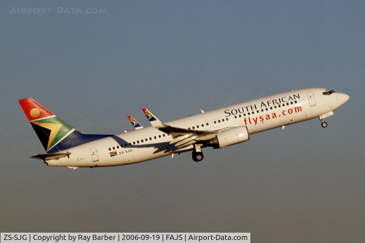 ZS-SJG, Boeing 737-8BG C/N 32353, Boeing 737-8BG [32353] (South African Airways) Johannesburg~ZS 19/09/2006. Seen departing .Taken through the glass of the terminal.