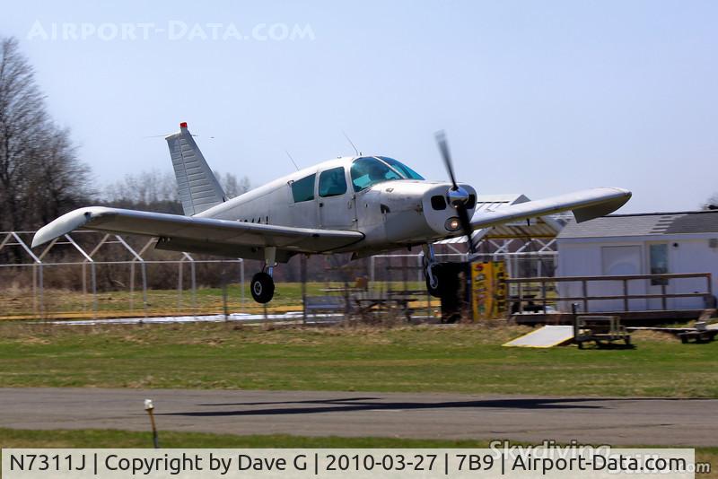 N7311J, 1968 Piper PA-28-140 C/N 28-24658, About to touch down at Ellington, CT