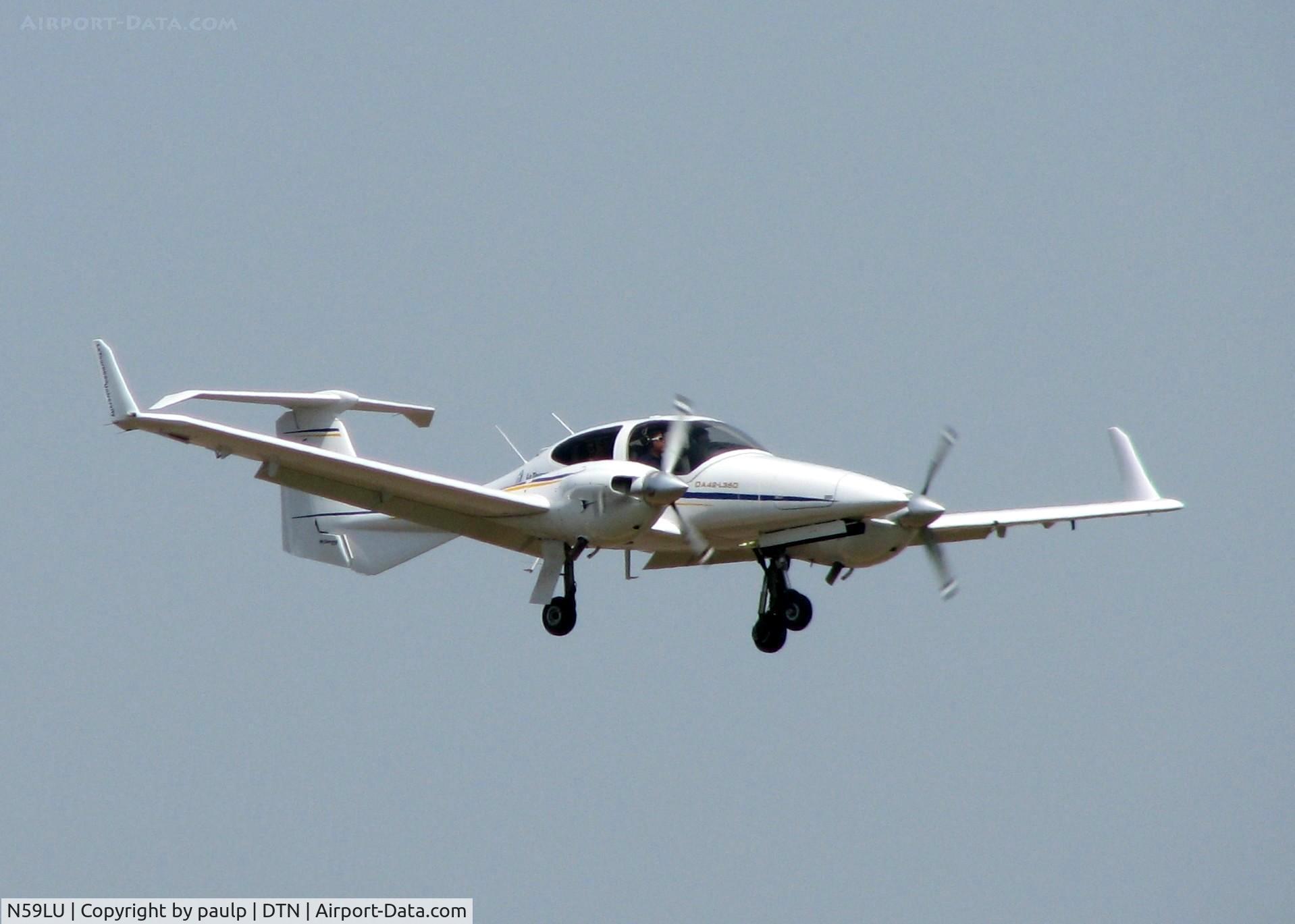 N59LU, 2009 Diamond DA-42 Twin Star C/N 42.AC148, Landing on runway 14 at Downtown Shreveport.