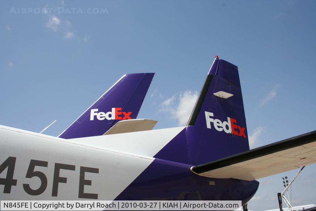 N845FE, 1989 Cessna 208B C/N 208B0152, C208 tail is eclipsed by a company A306 tail.
