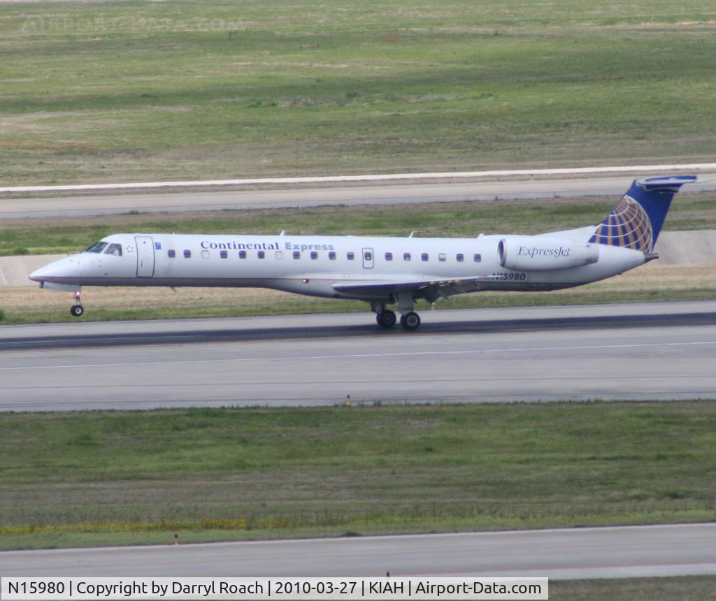 N15980, 1999 Embraer ERJ-145LR (EMB-145LR) C/N 145202, Touchdown on 26L, ever so gentle.