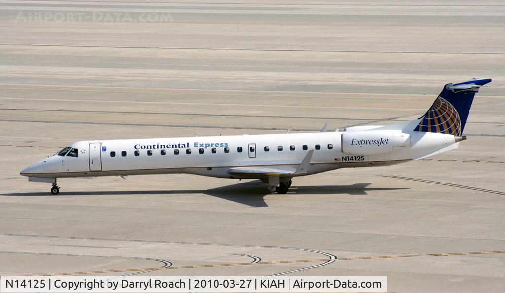 N14125, 2003 Embraer ERJ-145XR (EMB-145XR) C/N 145690, ERJ taxis though departures to get to his gate.