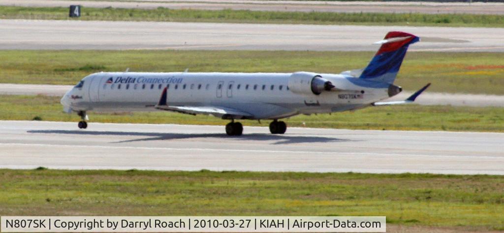 N807SK, 2006 Bombardier CRJ-900ER (CL-600-2D24) C/N 15082, DAL CRJ departs 15L.