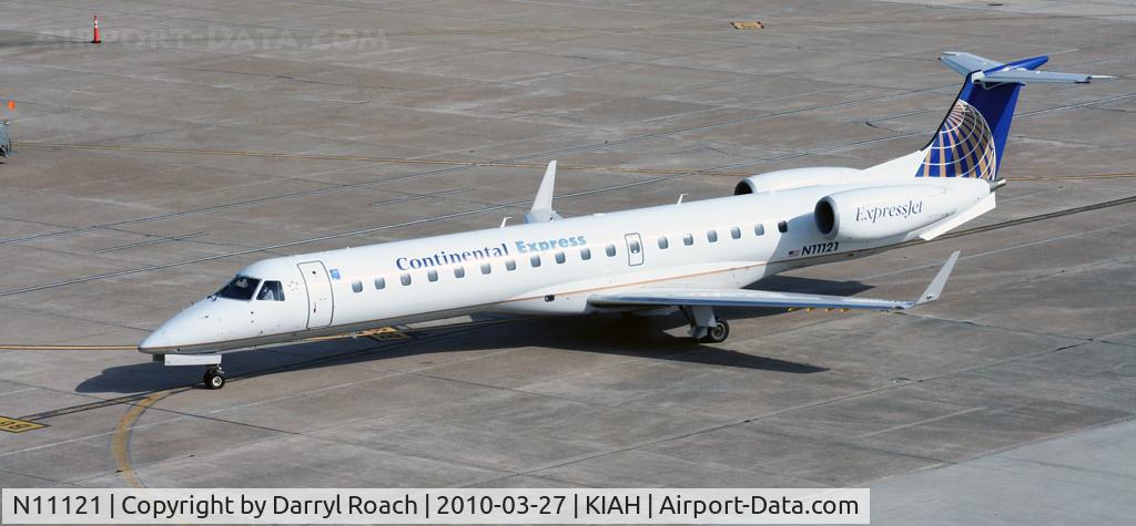 N11121, 2003 Embraer ERJ-145XR (EMB-145XR) C/N 145683, ERJ parks at the gate.