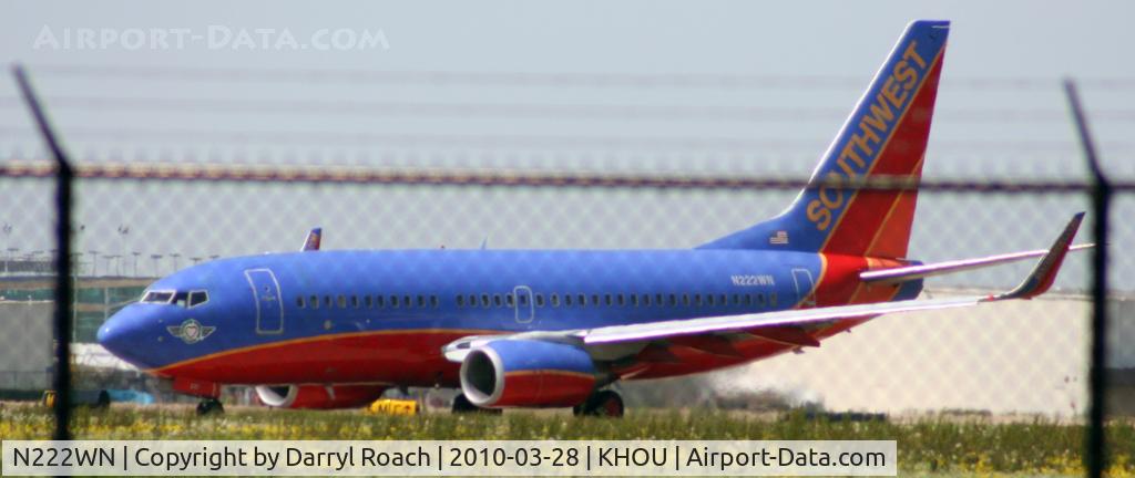 N222WN, 2005 Boeing 737-7H4 C/N 34290, B737 holds short 30L.