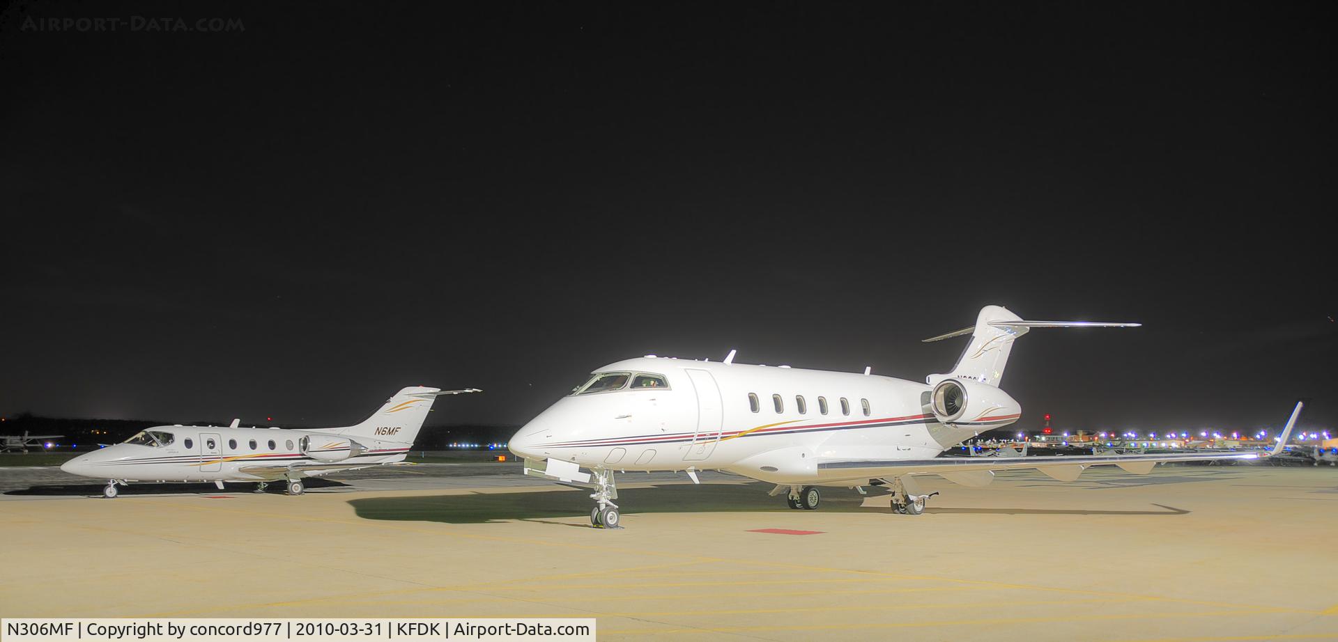 N306MF, 2004 Bombardier Challenger 300 (BD-100-1A10) C/N 20009, Seen at KFDK on 3/31/2010.  N6MF in the background.