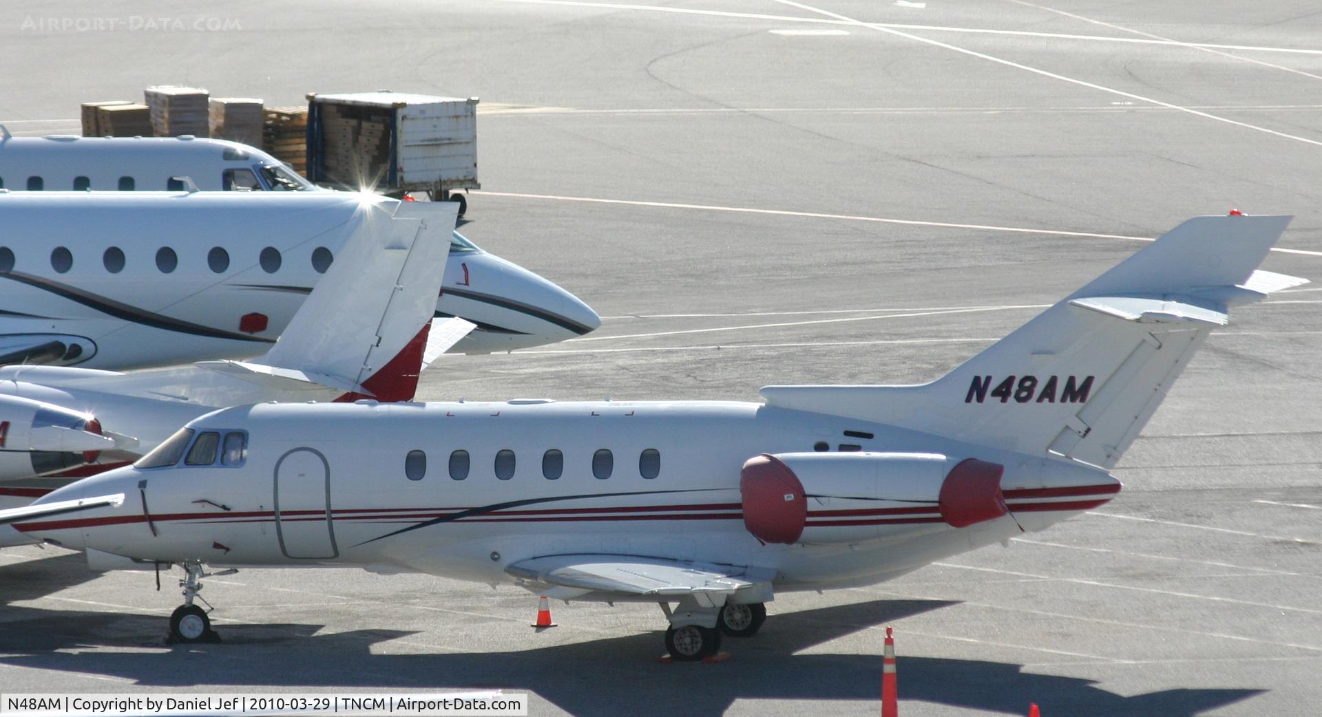 N48AM, 2002 Raytheon Hawker 800XP C/N 258582, N48AM park on the main ramp at TNCM