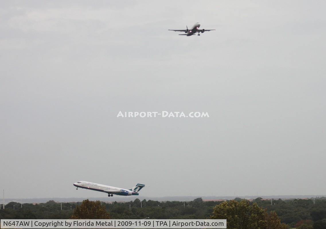 N647AW, 1997 Airbus A320-232 C/N 762, A near miss at TPA - US Airways A320 landing on Runway 9 due to hurricane off the coast, while an Air Tran 717 is departing