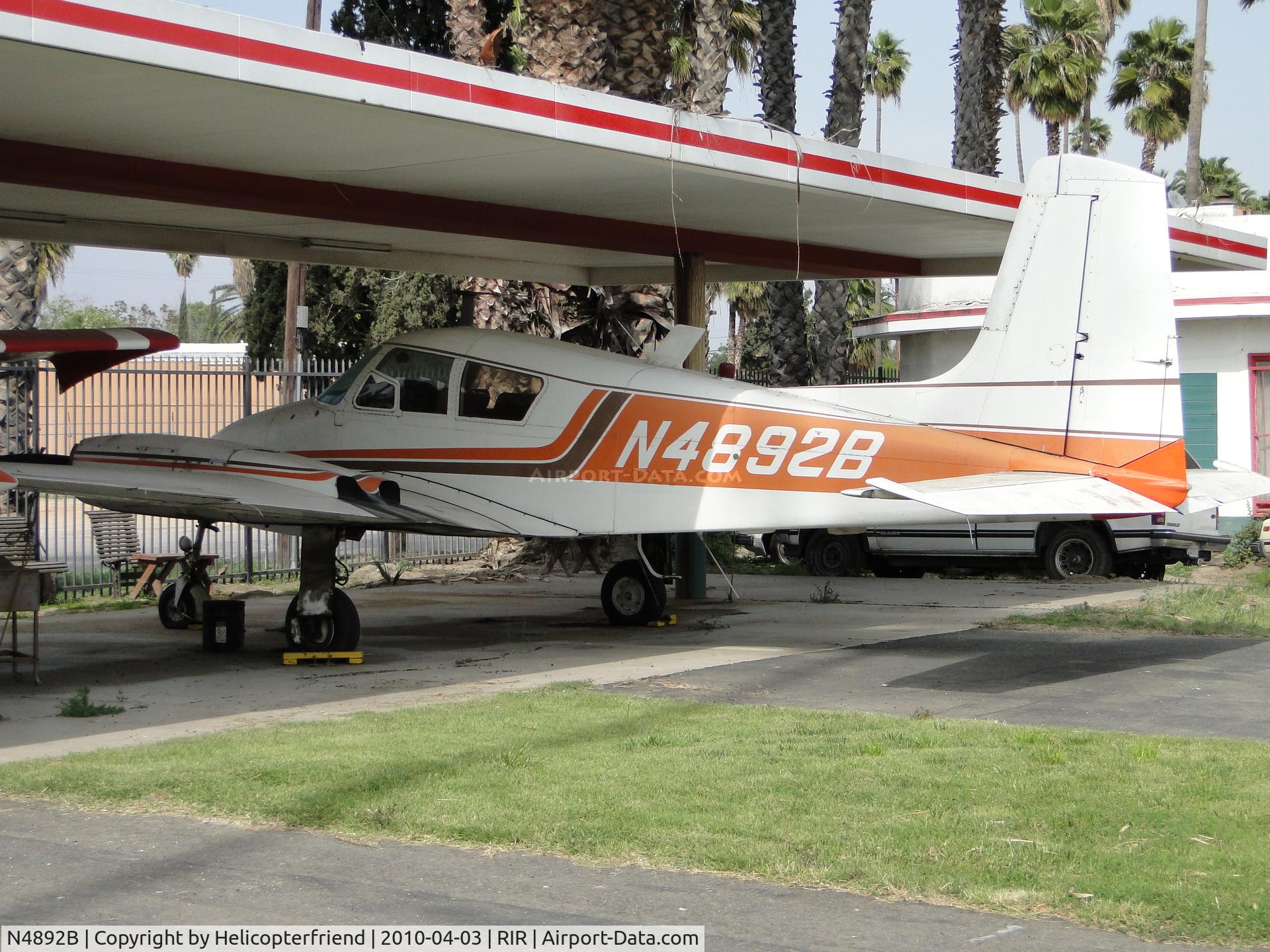 N4892B, 1955 Cessna 310 C/N 35192, Parked under a canopy