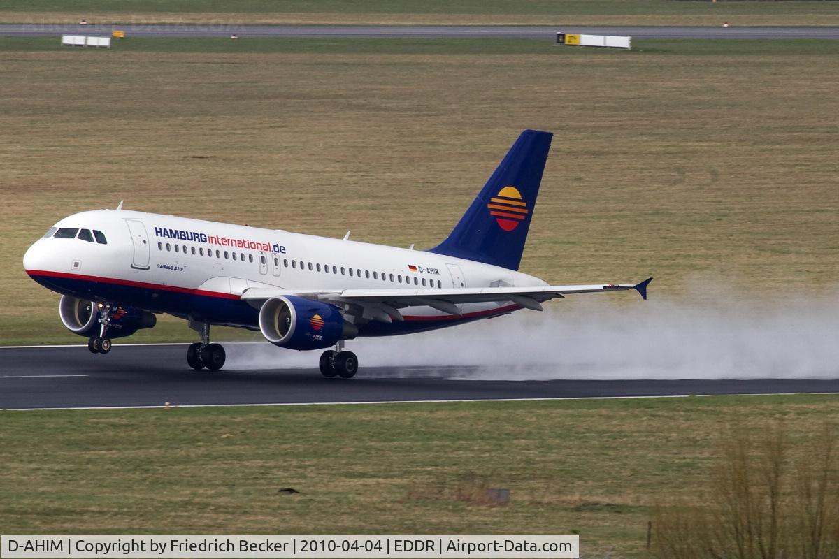 D-AHIM, 2009 Airbus A319-112 C/N 3818, departing a wet runway