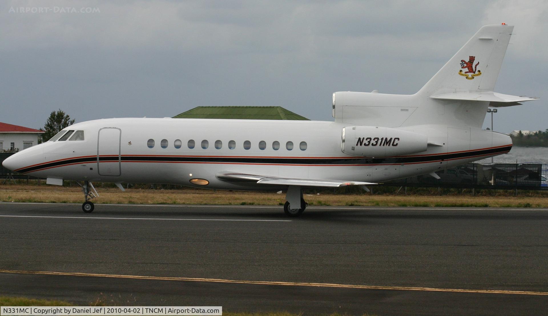 N331MC, 1997 Dassault Falcon 900EX C/N 22, N331MC just landed at TNCM runway 10 now back tracking the active for parking