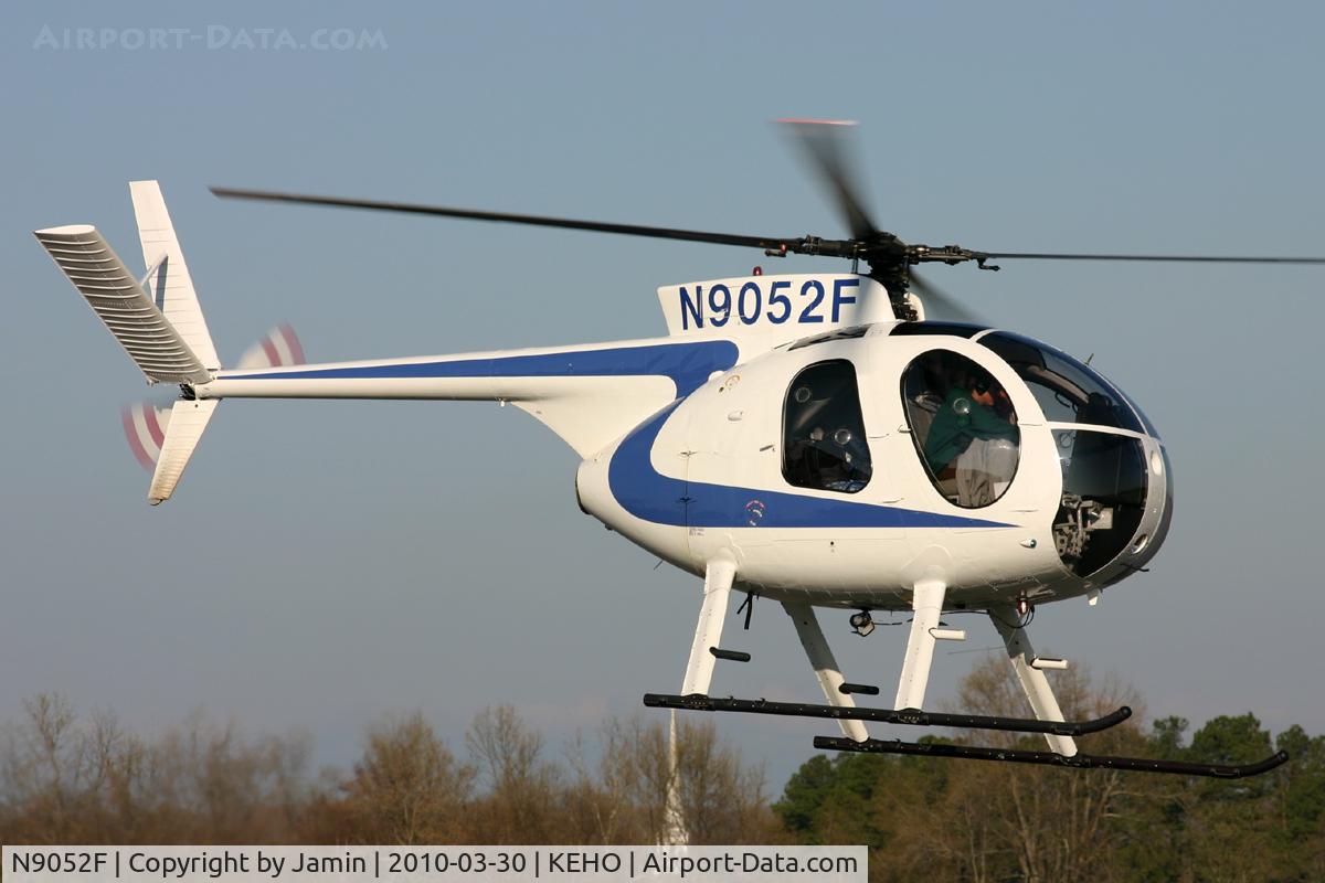 N9052F, 1970 Hughes 369HS C/N 1290225S, A very smart looking helicopter leaving the airport.