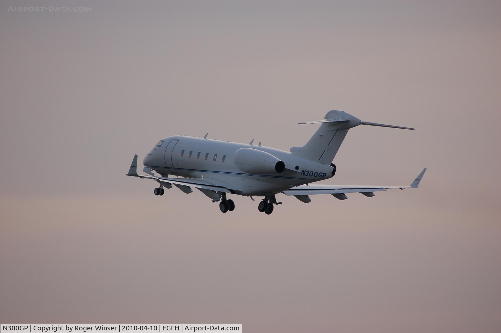 N300GP, Bombardier Challenger 300 (BD-100-1A10) C/N 20253, Challenger 300 departing Swansea Airport at dusk
