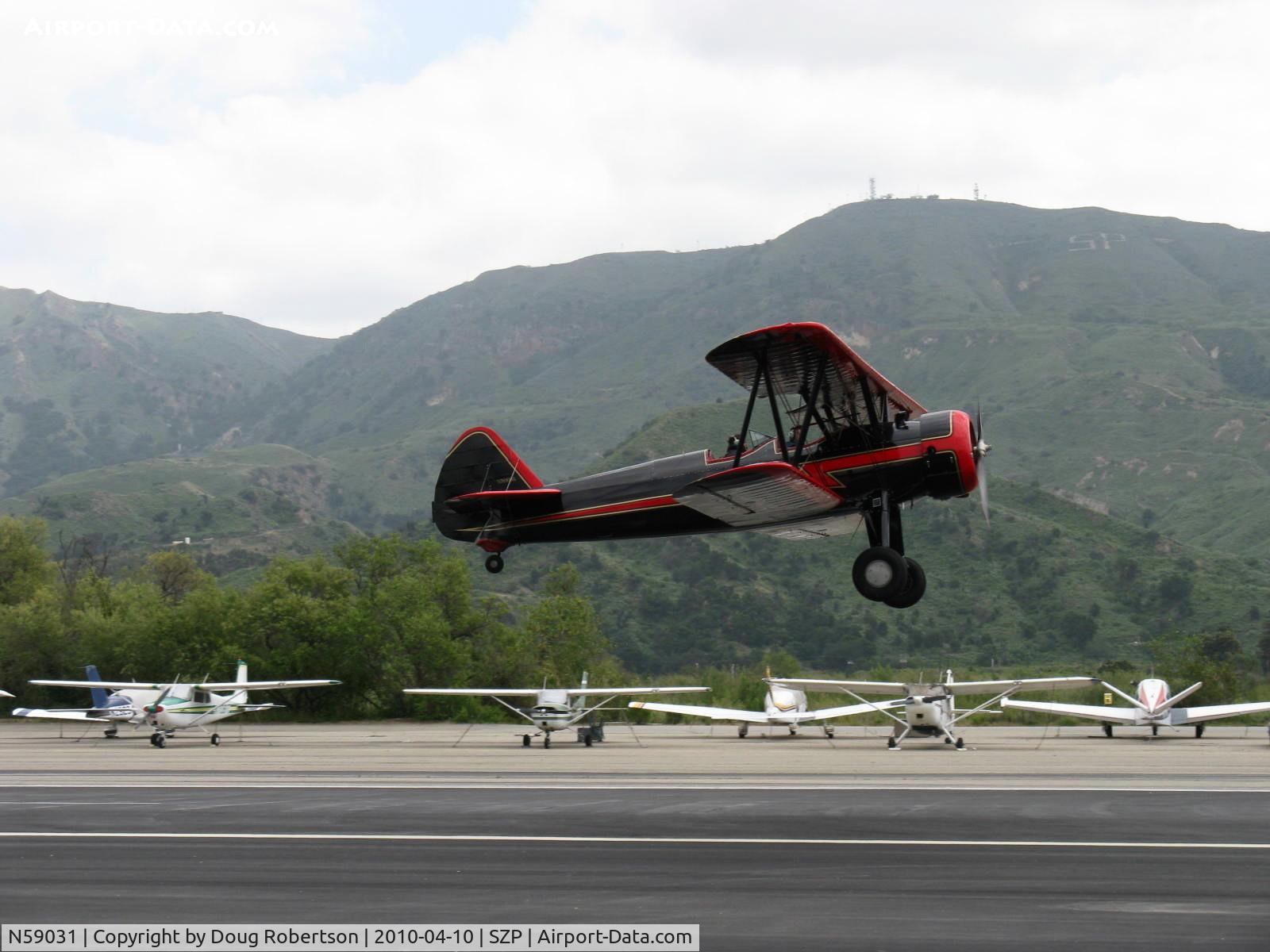 N59031, 1941 Boeing A75N1(PT17) C/N 75-3808, 1941 Boeing Stearman A75N1, Continental W670 220 Hp, takeoff climb Rwy 22