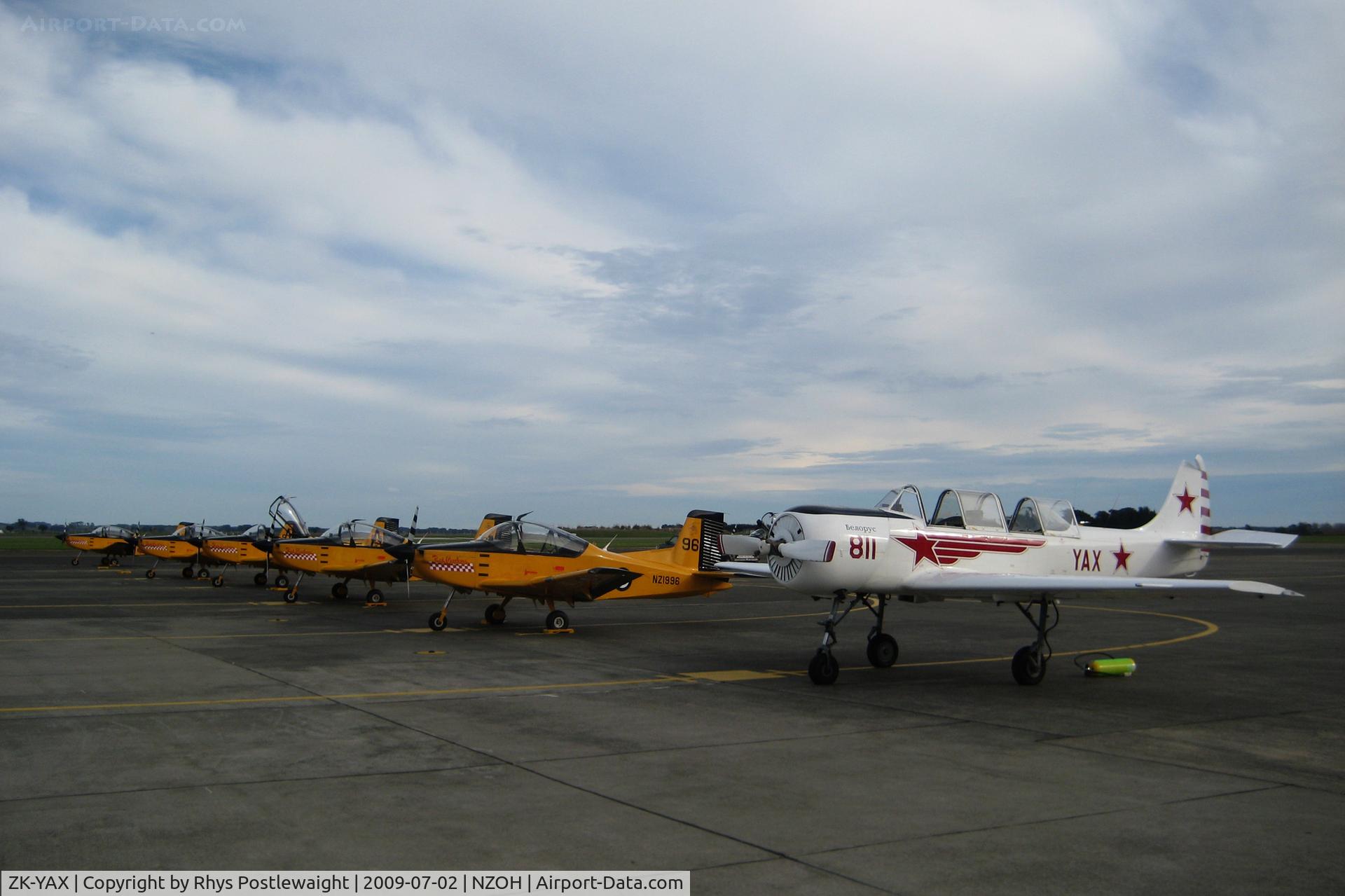 ZK-YAX, Yakovlev Yak-52 C/N 811811, On the RNZAF Pilot Training Squadron flight line with PACL CT4E Airtrainers in the background.