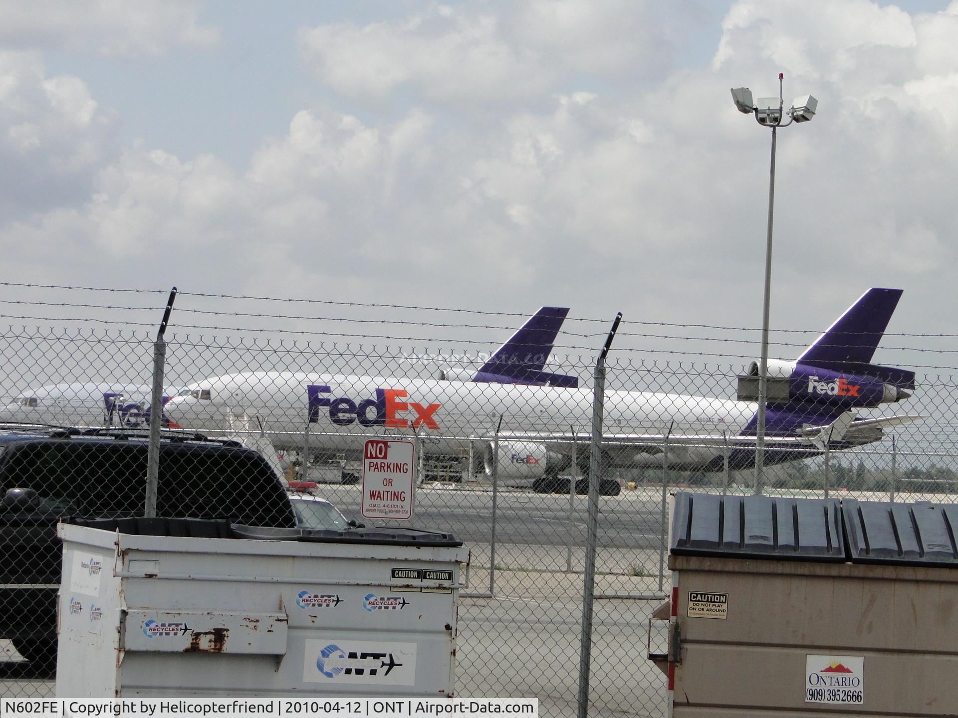 N602FE, 1990 McDonnell Douglas MD-11F C/N 48402, Parked and being loaded behind Fed Ex Bldg at Ontario