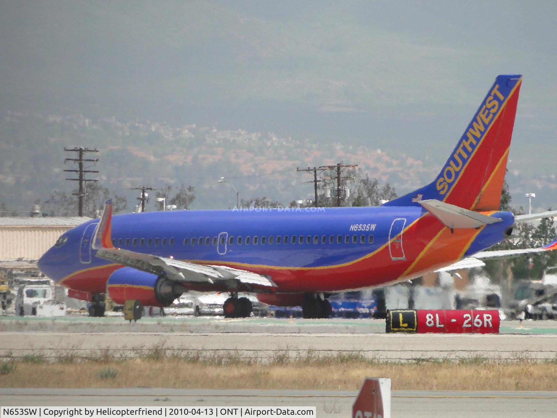 N653SW, 1997 Boeing 737-3H4 C/N 28398, Turning off of Runway 26R onto Taxiway L