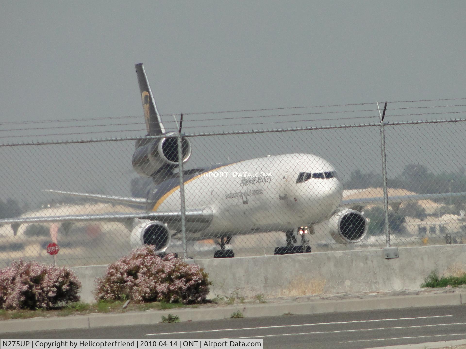 N275UP, 1997 McDonnell Douglas MD-11F C/N 48774, Taxiing to UPS lot at Southeast side of the airport