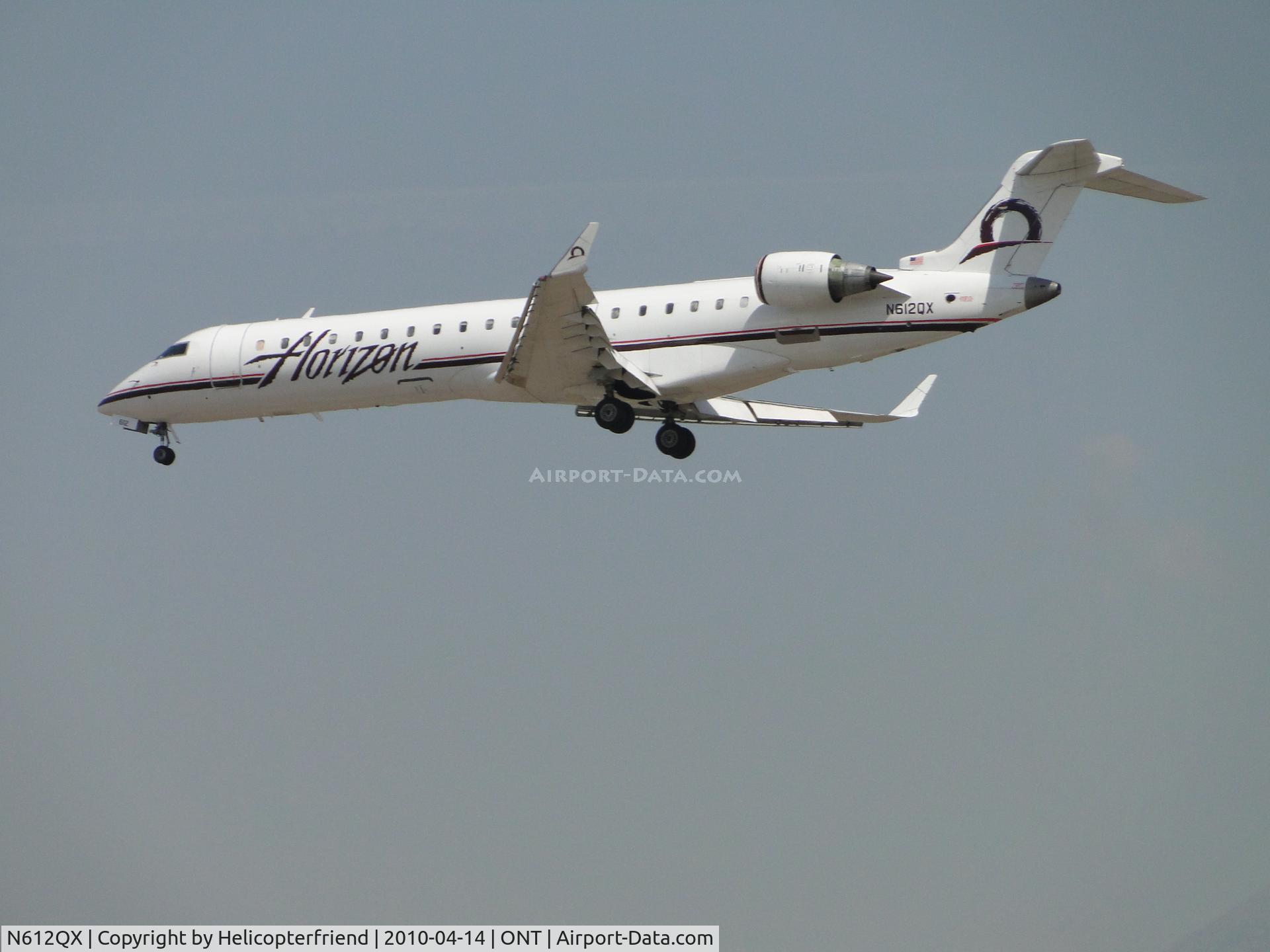N612QX, 2002 Bombardier CRJ-701 (CL-600-2C10) Regional Jet C/N 10042, On final for runway 26R at Ontario