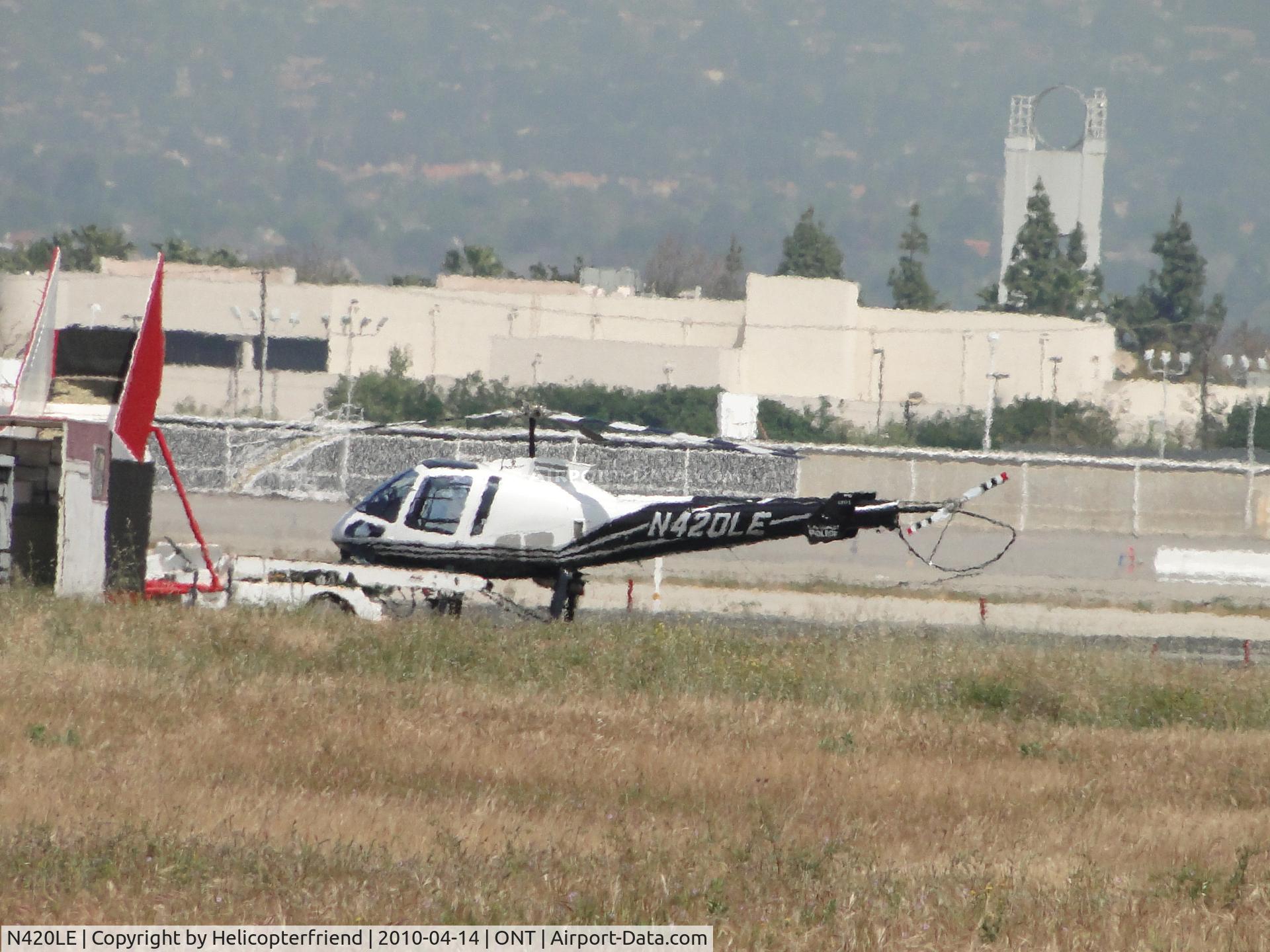 N420LE, 2006 Enstrom 480B C/N 5101, LA Impact parked at Ontario