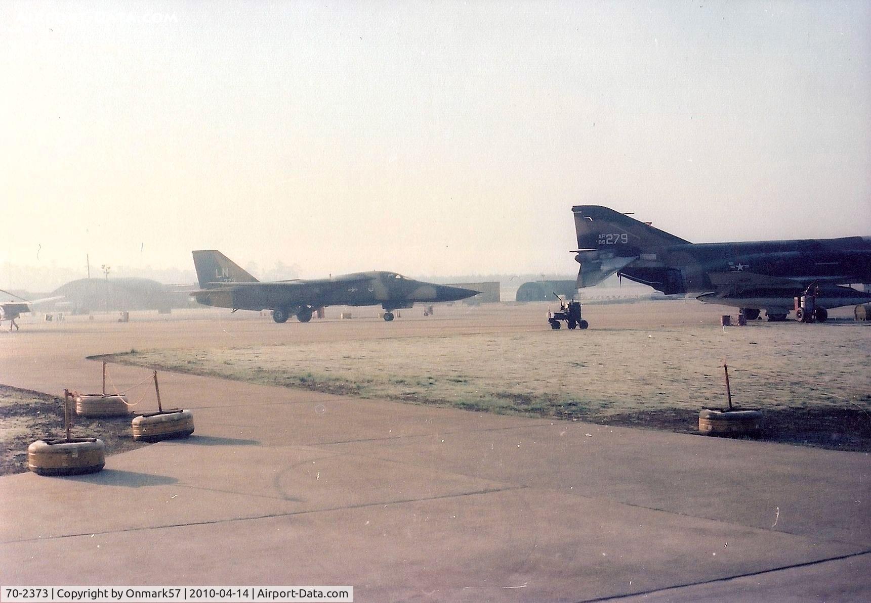 70-2373, 1970 General Dynamics F-111F Aardvark C/N E2-12, F-111F. 70-2373  Taxiing by F-4D's at RAF Lakenheath, 1977