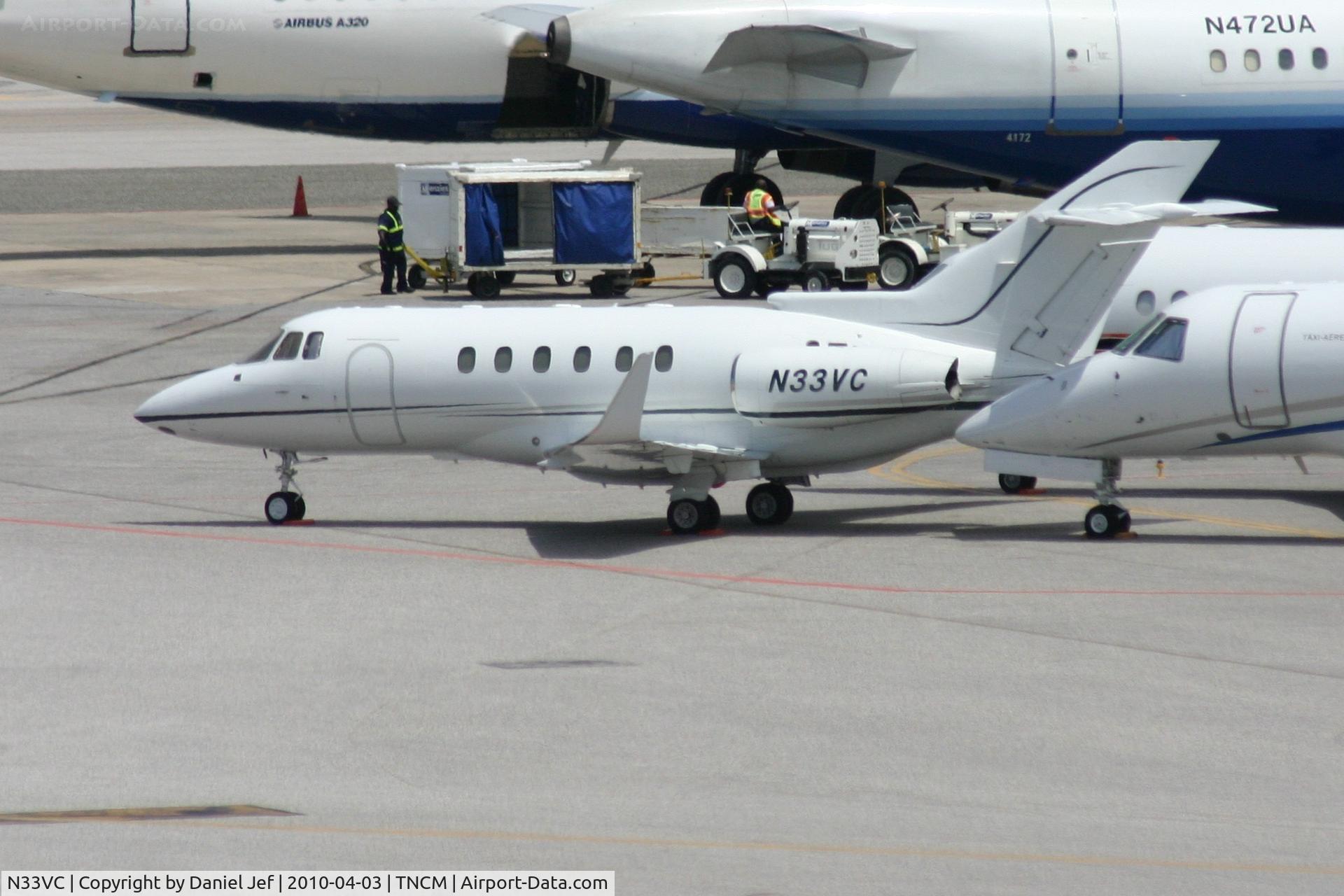 N33VC, 1996 Raytheon Hawker 800XP C/N 258310, N33VC park on the main ramp at TNCM