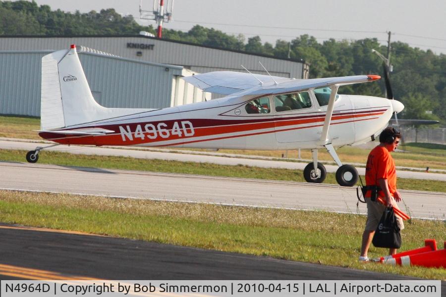 N4964D, 1958 Cessna 182A Skylane C/N 51064, Departing Lakeland, FL during Sun N Fun 2010