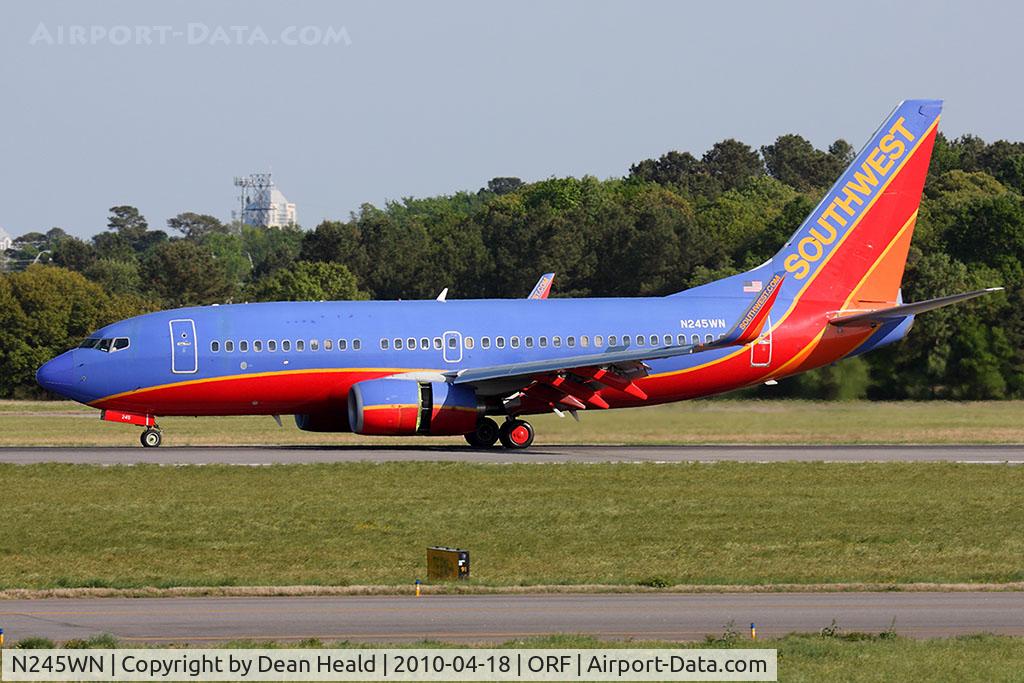 N245WN, 2006 Boeing 737-7H4 C/N 32506, Southwest Airlines N245WN (FLT SWA3760) rolling out on RWY 5 after arrival from Jacksonville Int'l (KJAX).