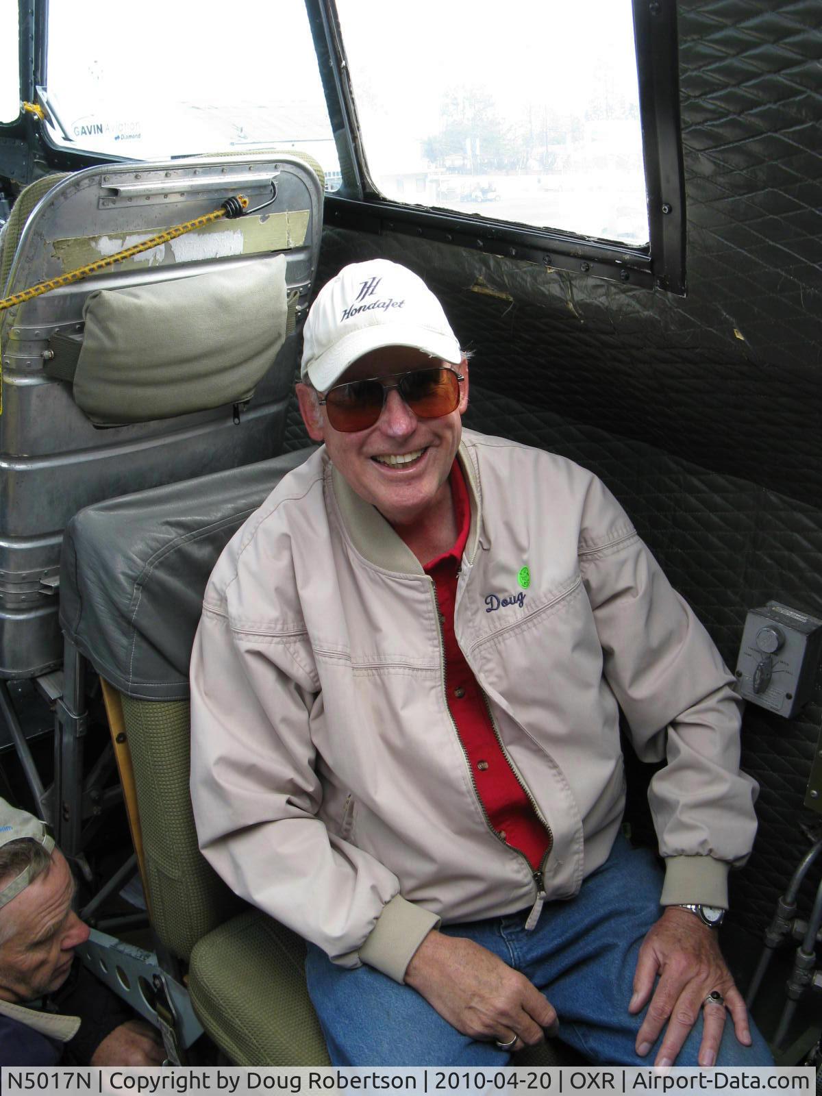 N5017N, 1944 Lockheed/Vega (Boeing) B-17G-105-VE Flying Fortress C/N 8649, 1944 Boeing B-17G Flying Fortress 'Aluminum Overcast', Photographer in jump seat behind co-pilot taken by EAA aircraft docent, Thank You! Man below is at ladder down to navigator and bombardier forward nose areas. 