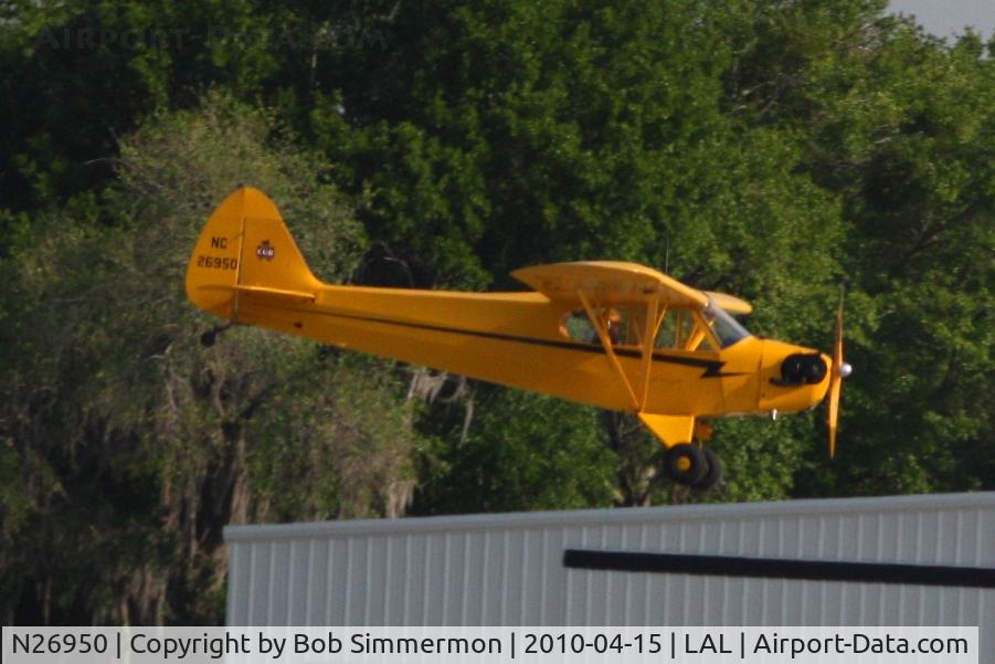 N26950, Piper J3C-65 Cub C/N 20974, Arriving at Lakeland, FL during Sun N Fun 2010.
