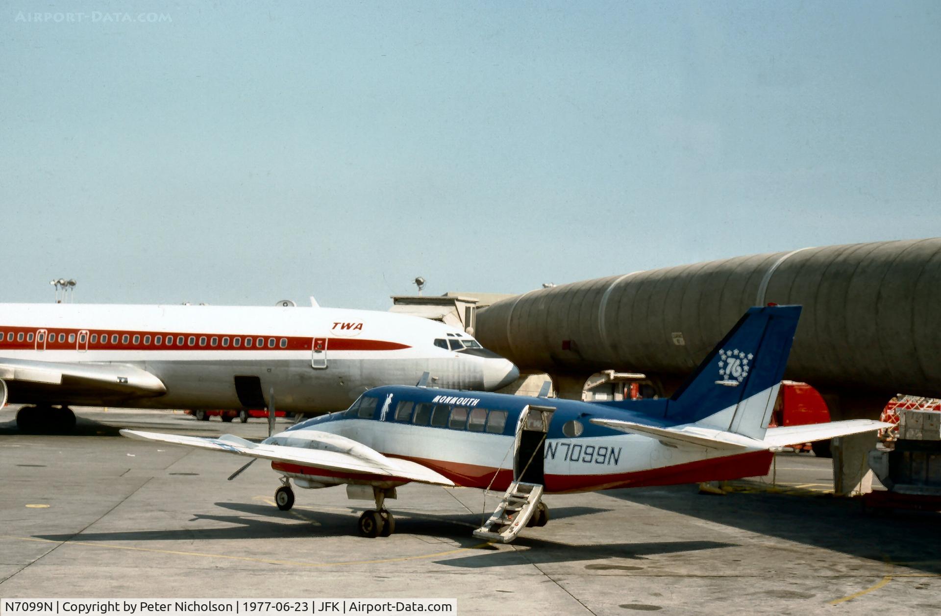 N7099N, 1968 Beech 99 C/N U-1, Beech 99 of Monmouth Airlines of Farmingdale at the terminal gate at Kennedy in the Summer of 1977.