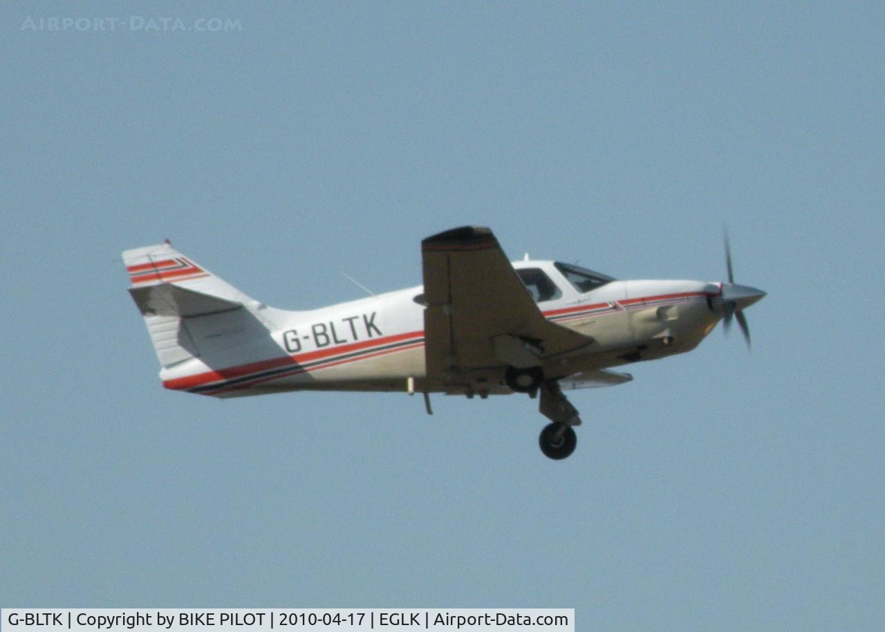 G-BLTK, 1976 Rockwell Commander 112TC C/N 13106, TUCKING THE GEAR UP ON CLIMB OUT FROM RWY 07