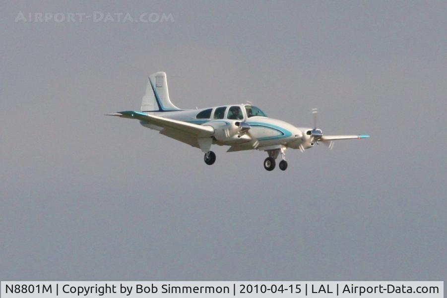 N8801M, 1964 Beech D95A Travel Air C/N TD-569, Arriving at Lakeland, FL during Sun N Fun 2010.