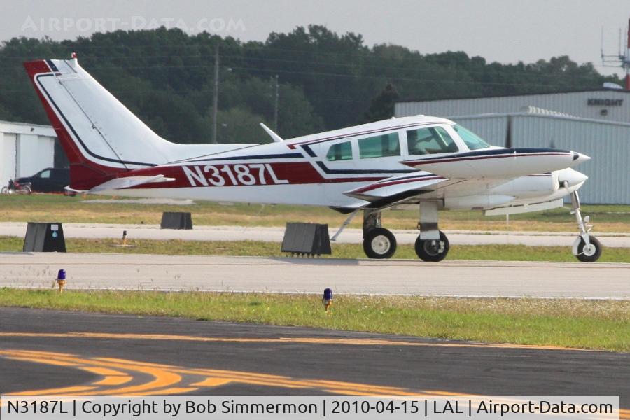 N3187L, 1965 Cessna 310J C/N 310J0187, Departing Lakeland, FL during Sun N Fun 2010