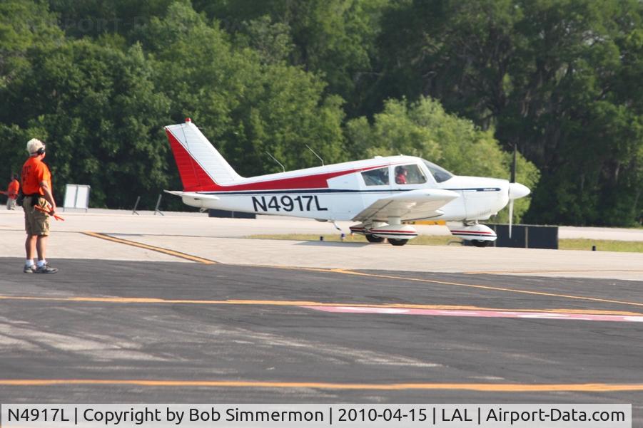 N4917L, 1967 Piper PA-28-180 C/N 28-4282, Departing Lakeland, FL during Sun N Fun 2010