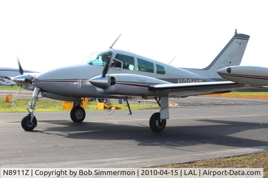 N8911Z, 1961 Cessna 310G C/N 310G0011, Departing Lakeland, FL during Sun N Fun 2010