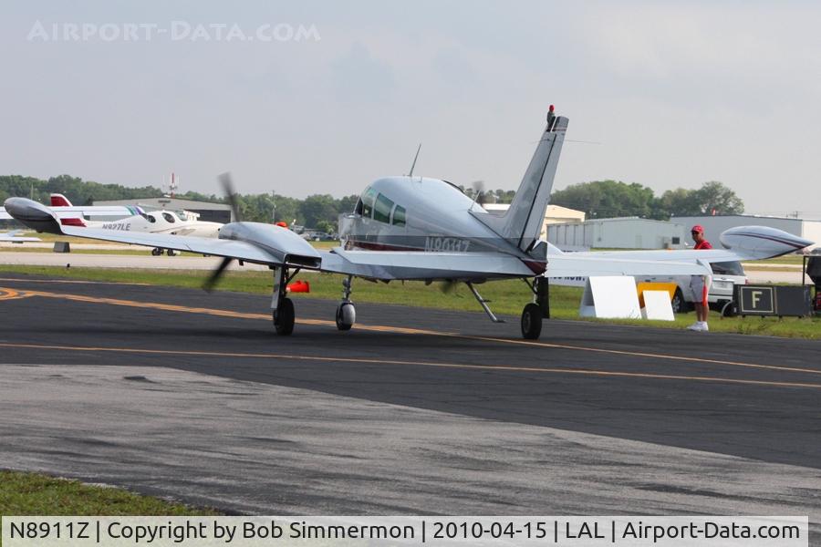 N8911Z, 1961 Cessna 310G C/N 310G0011, Departing Lakeland, FL during Sun N Fun 2010