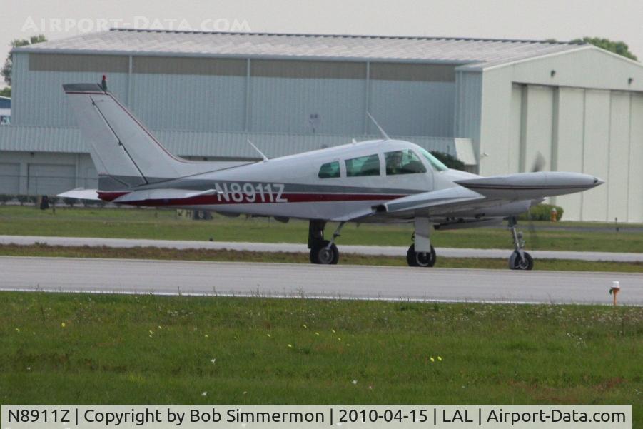 N8911Z, 1961 Cessna 310G C/N 310G0011, Departing Lakeland, FL during Sun N Fun 2010