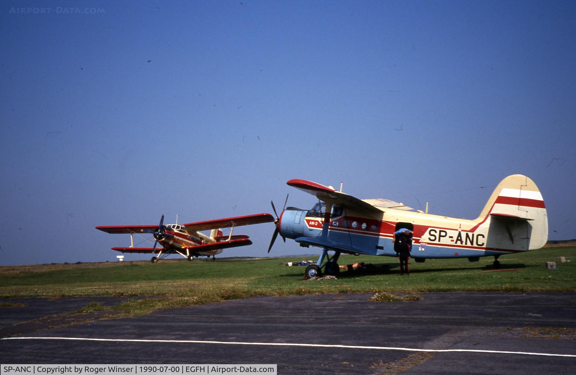 SP-ANC, Antonov An-2TD C/N 1G52-14, Used by skydivers during Skyvan Boggie events in the late 1980's and 1990. SP-ANU in the background. Photo taken July 1990.