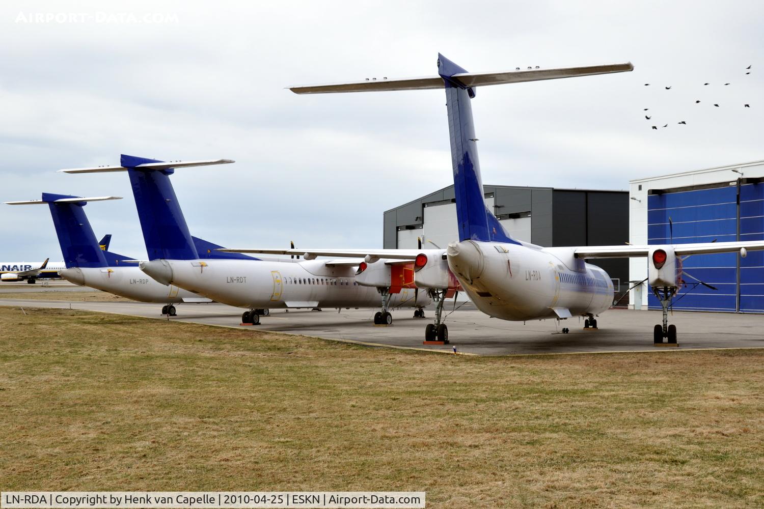 LN-RDA, 1999 De Havilland Canada DHC-8-402Q Dash 8 C/N 4013, SAS Commuter Dash 8 400s at Nyköping Skavsta airport in Sweden. These are LN-RDA (in front), LN-RDT and LN-RDP, which are in storage after being taken out of service by SAS after a series of main landing gear collapses.
