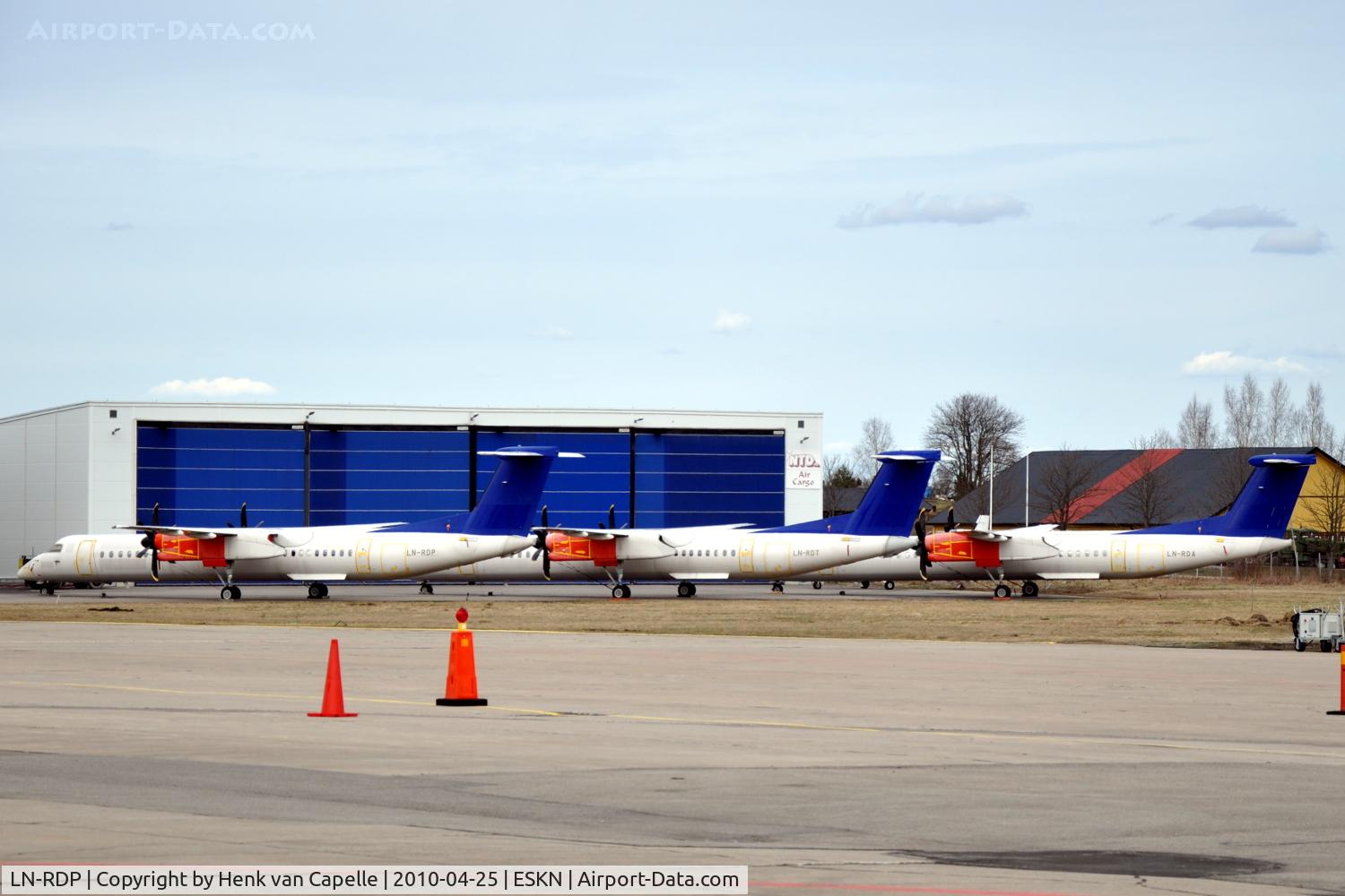 LN-RDP, 1999 De Havilland Canada DHC-8-402Q Dash 8 C/N 4012, SAS Commuter Dash 8 400s at Nyköping Skavsta airport in Sweden. These are LN-RDP (in front), LN-RDT and LN-RDA, which are in storage after being taken out of service by SAS after a series of main landing gear collapses.