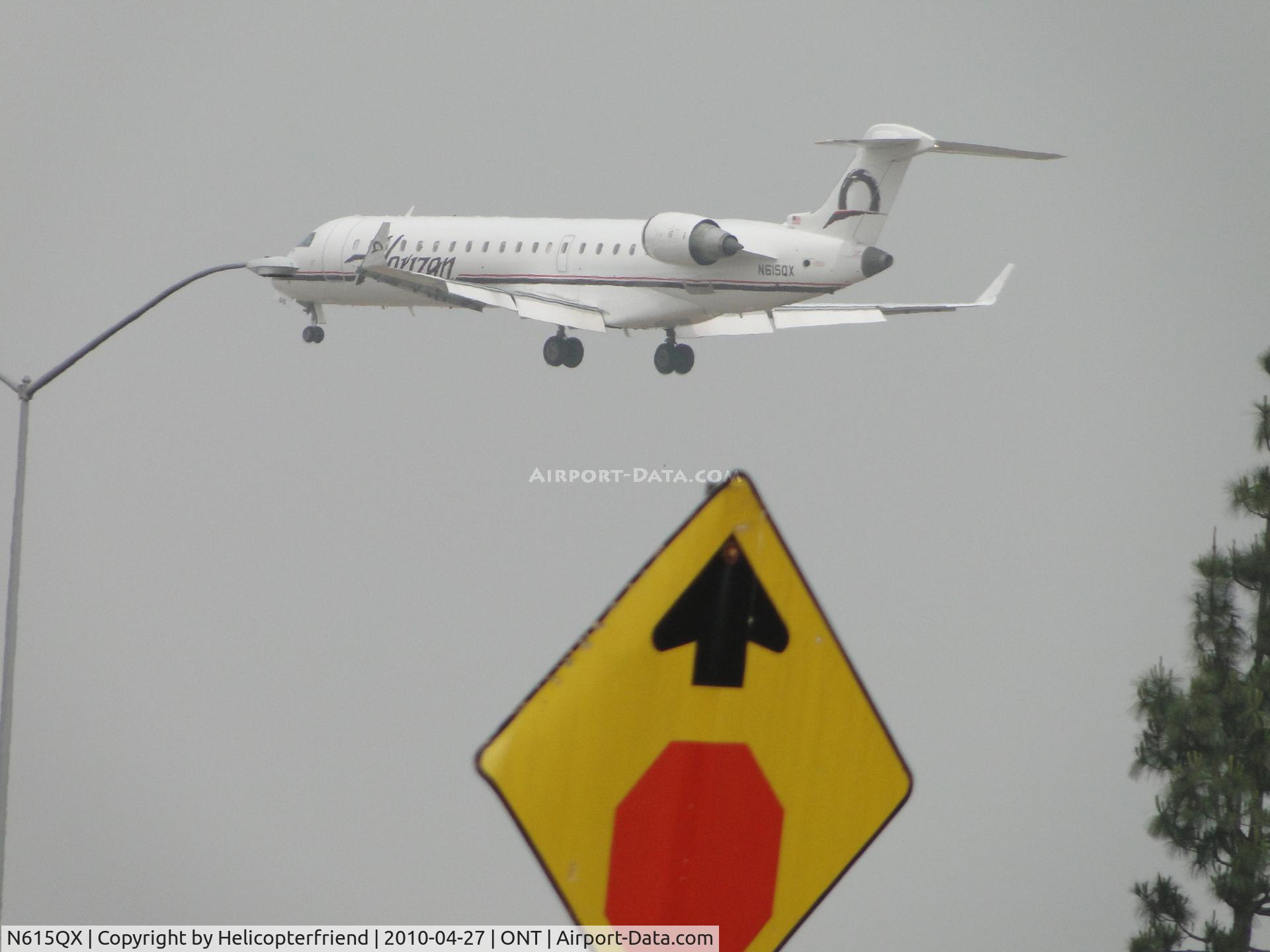 N615QX, 2002 Bombardier CRJ-701 (CL-600-2C10) Regional Jet C/N 10065, In the fog, refused to stop and looks like it almost hit the light