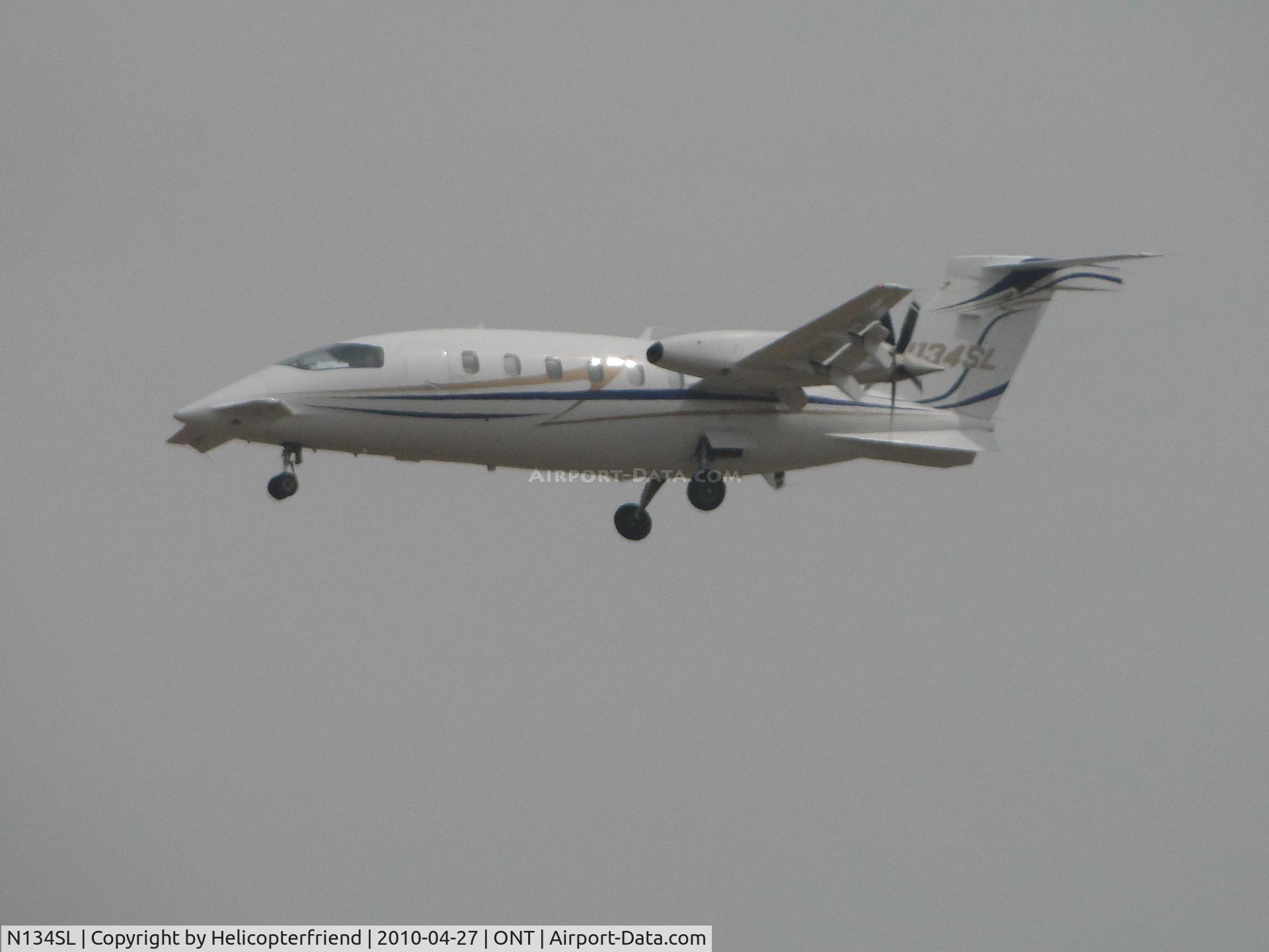 N134SL, Piaggio P-180 C/N 1100, On foggy final to runway 26R