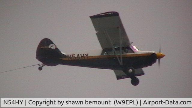 N54HY, 2001 Aviat A-1B Husky C/N 2130, flying south with a good tail wind.. looks like fun..  just off shore